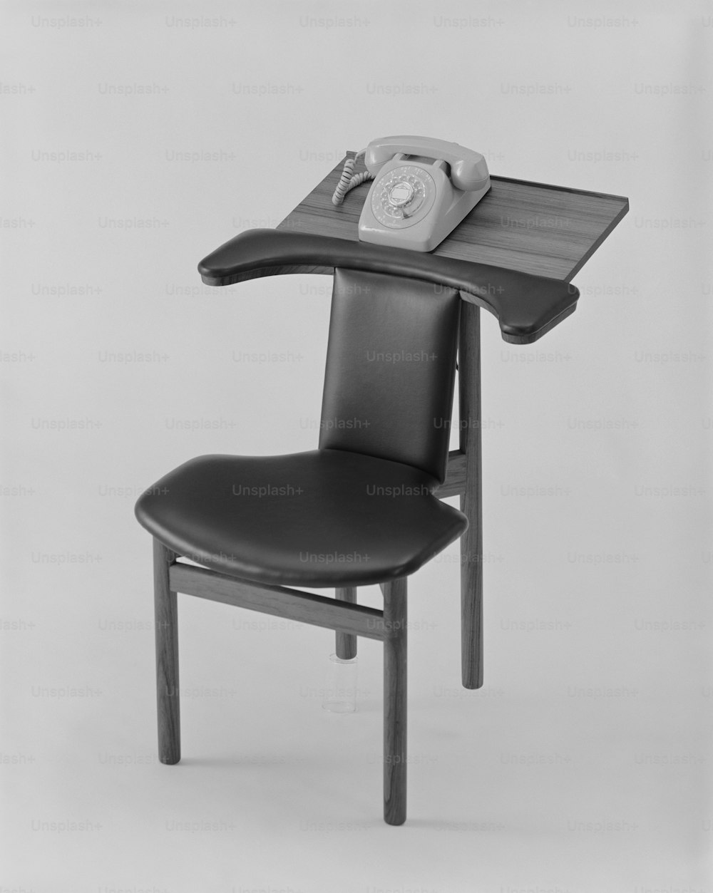 a chair with a phone on top of it