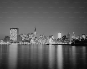 a black and white photo of a city at night