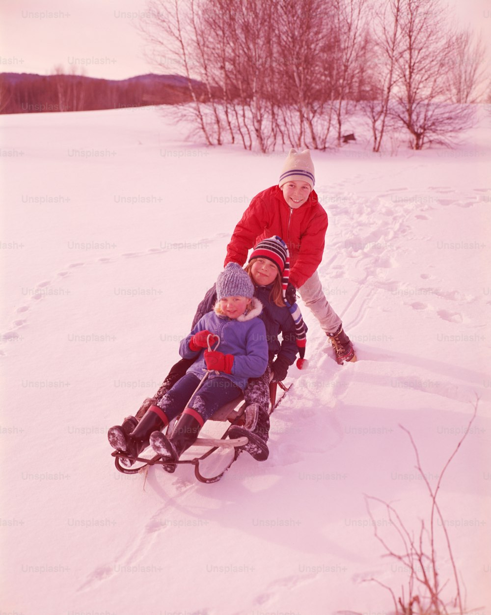 UNITED STATES - CIRCA 1950s:  Children on sled.