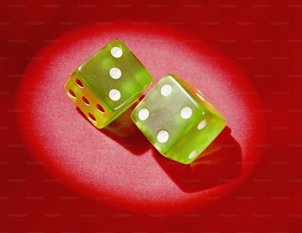 UNITED STATES - CIRCA 1960s:  Pair of green plastic dice, showing 'lucky 7'.