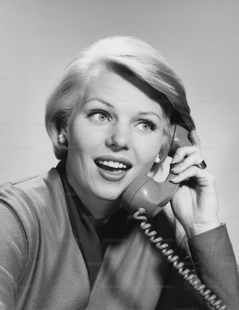 UNITED STATES - CIRCA 1960s:  Woman on telephone, smiling.