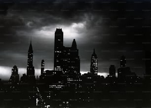 a black and white photo of a city at night