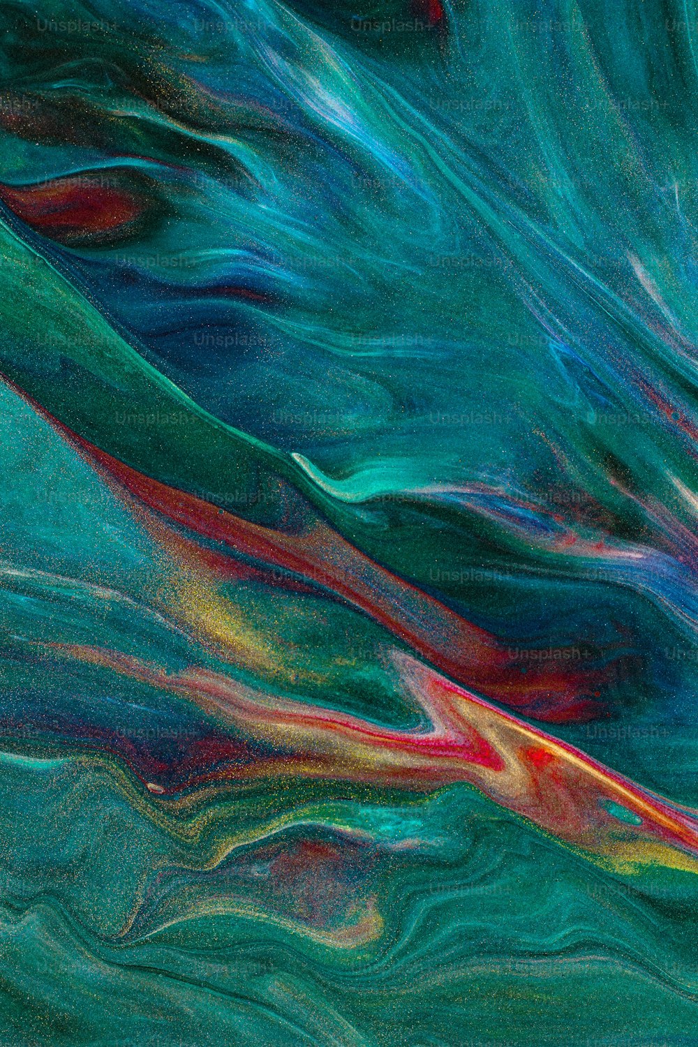 an abstract painting of blue, red, and green colors