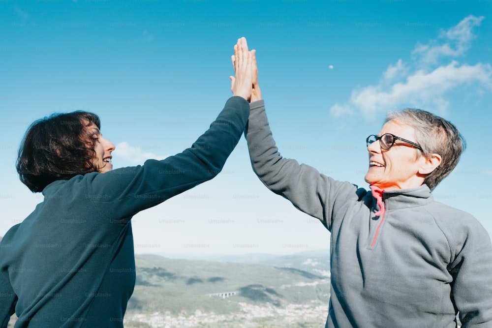 a man and a woman high fiving each other