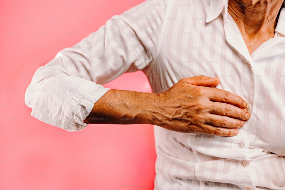 a woman holding her hands on her chest