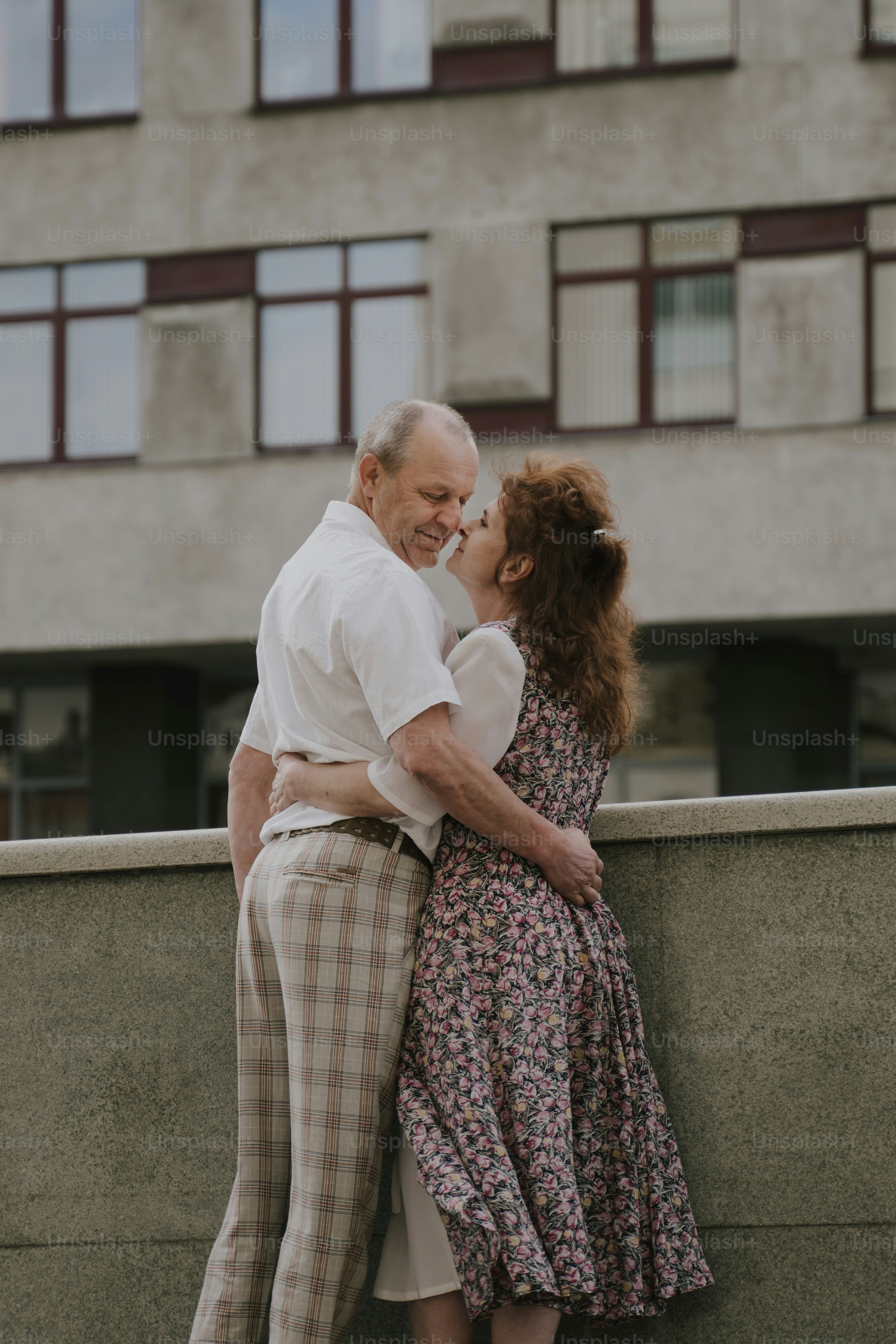 a man and a woman standing next to each other