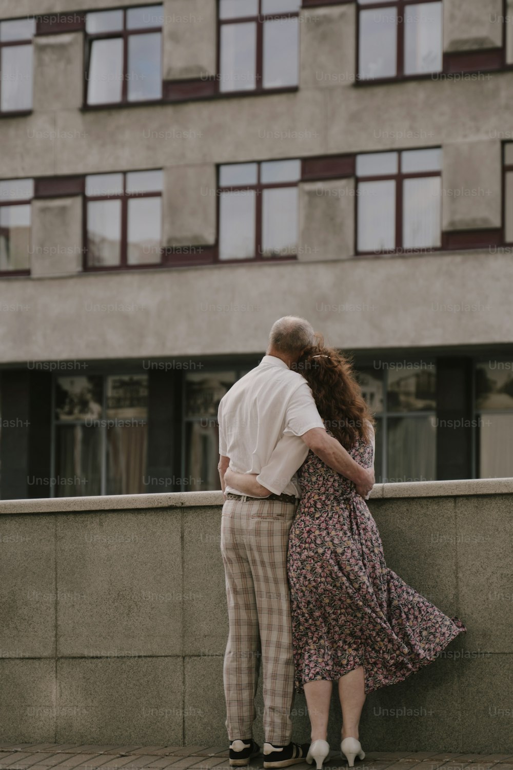 a man and a woman standing next to each other