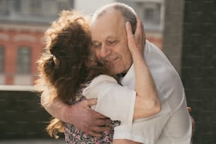 a man and a woman embracing each other