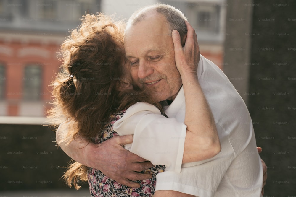 a man and a woman embracing each other