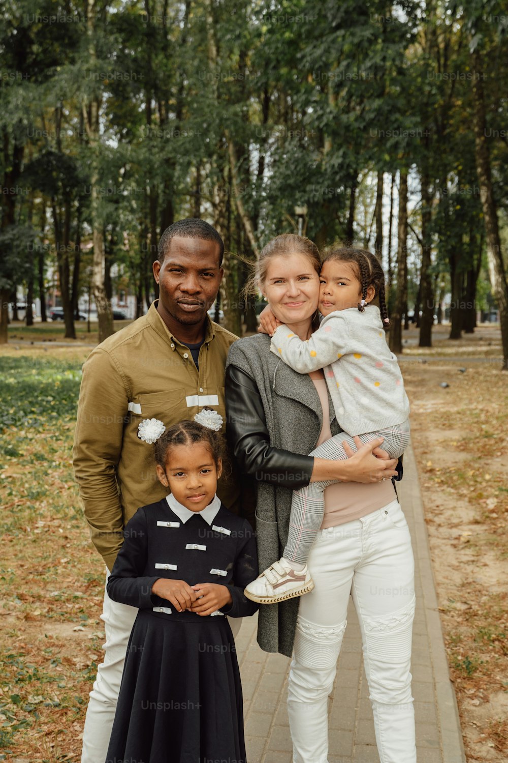 a man, woman, and child posing for a picture