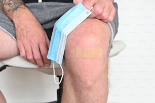 a man with a bandage on his knee