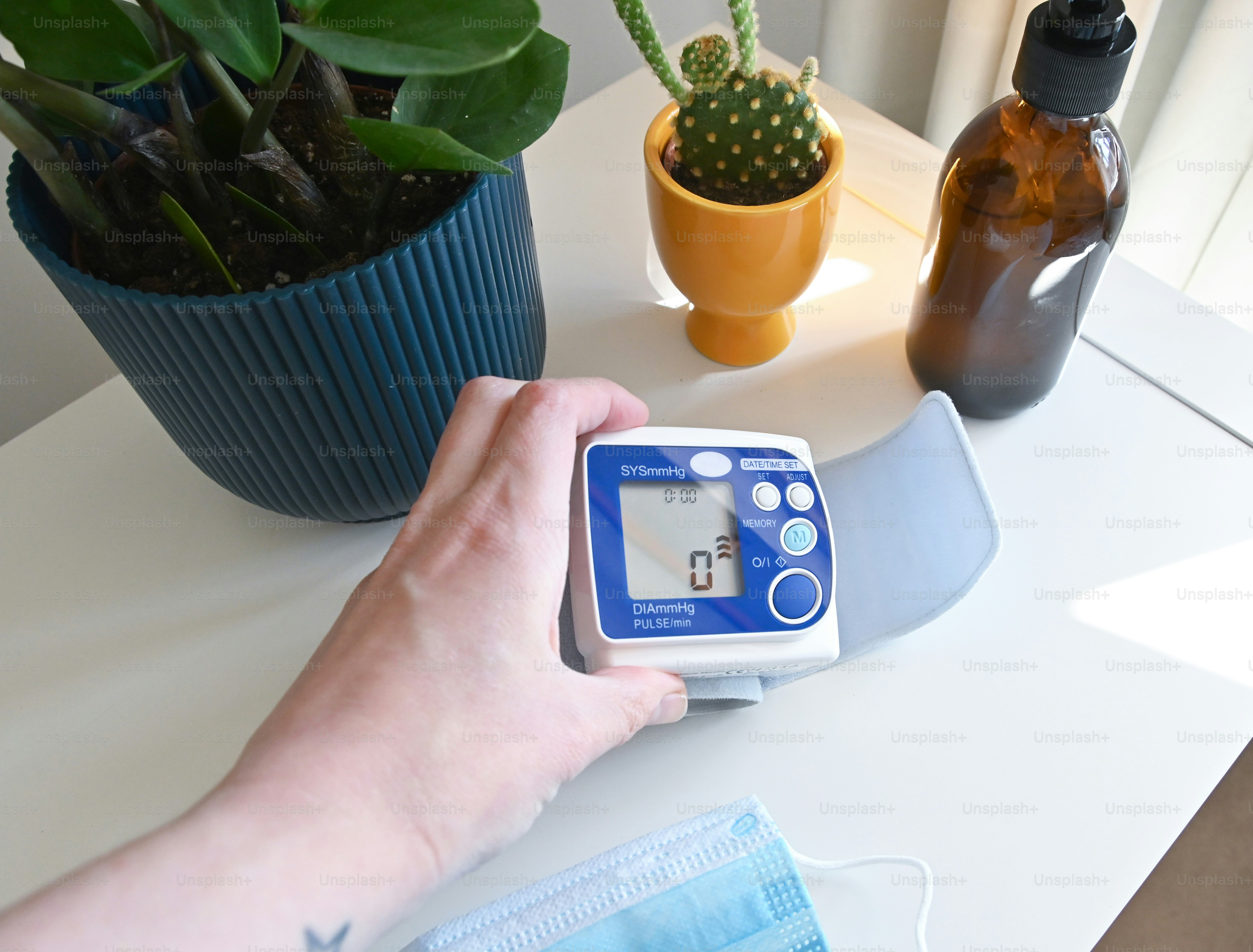 a person wearing a face mask and a medical device