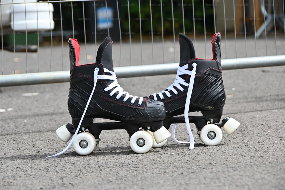 a pair of roller skates sitting on the ground