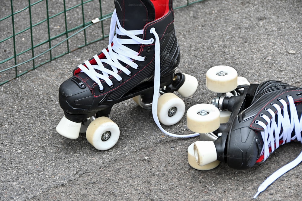 a pair of roller skates sitting next to each other