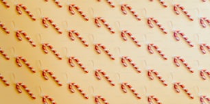 candy canes are arranged on a yellow background