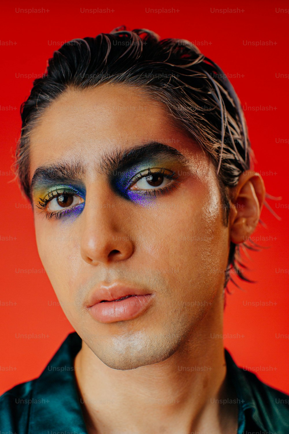 a man with a blue and yellow make up