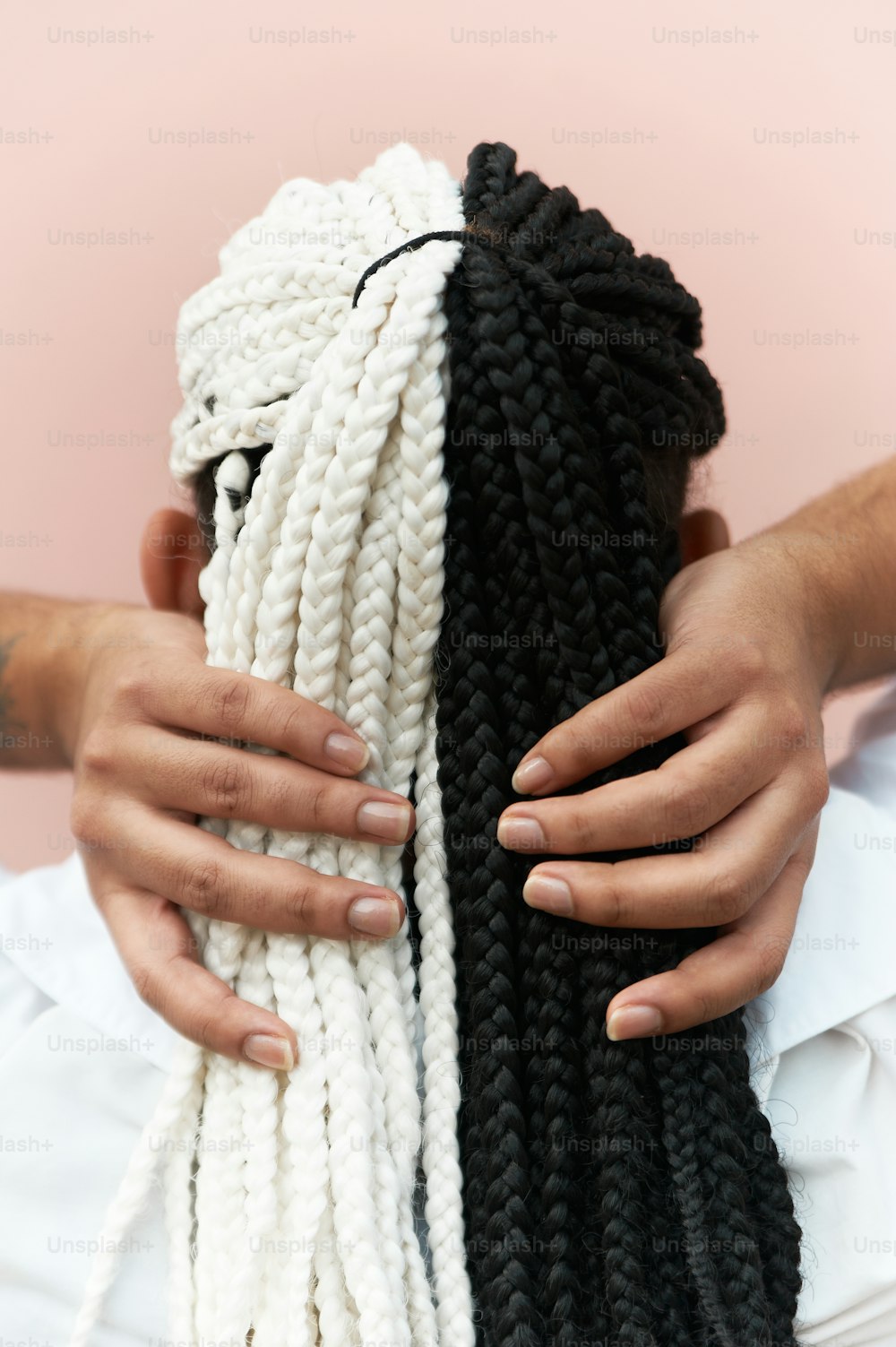 a person holding a black and white rope