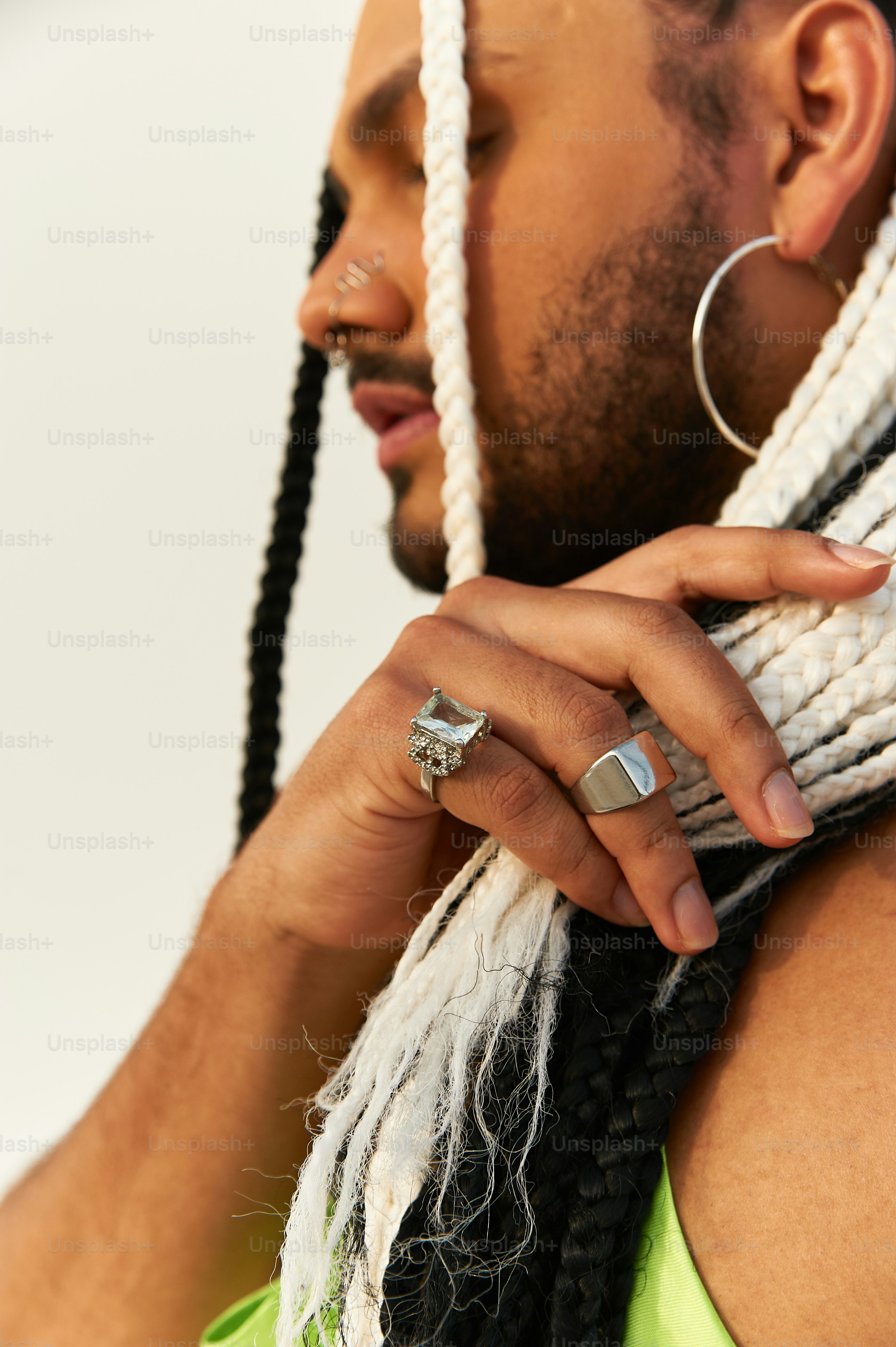a man with dreadlocks and a ring on his finger
