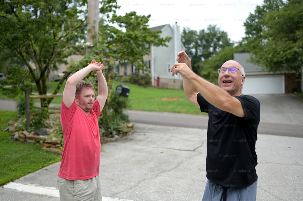 a couple of men standing next to each other