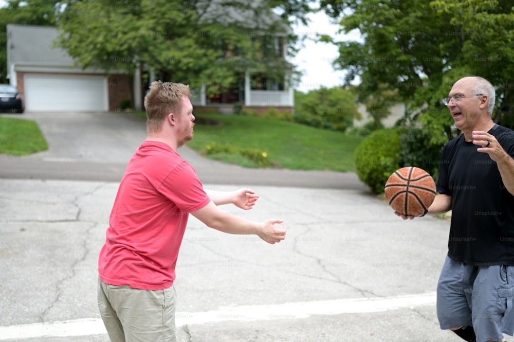 a couple of men playing a game of basketball