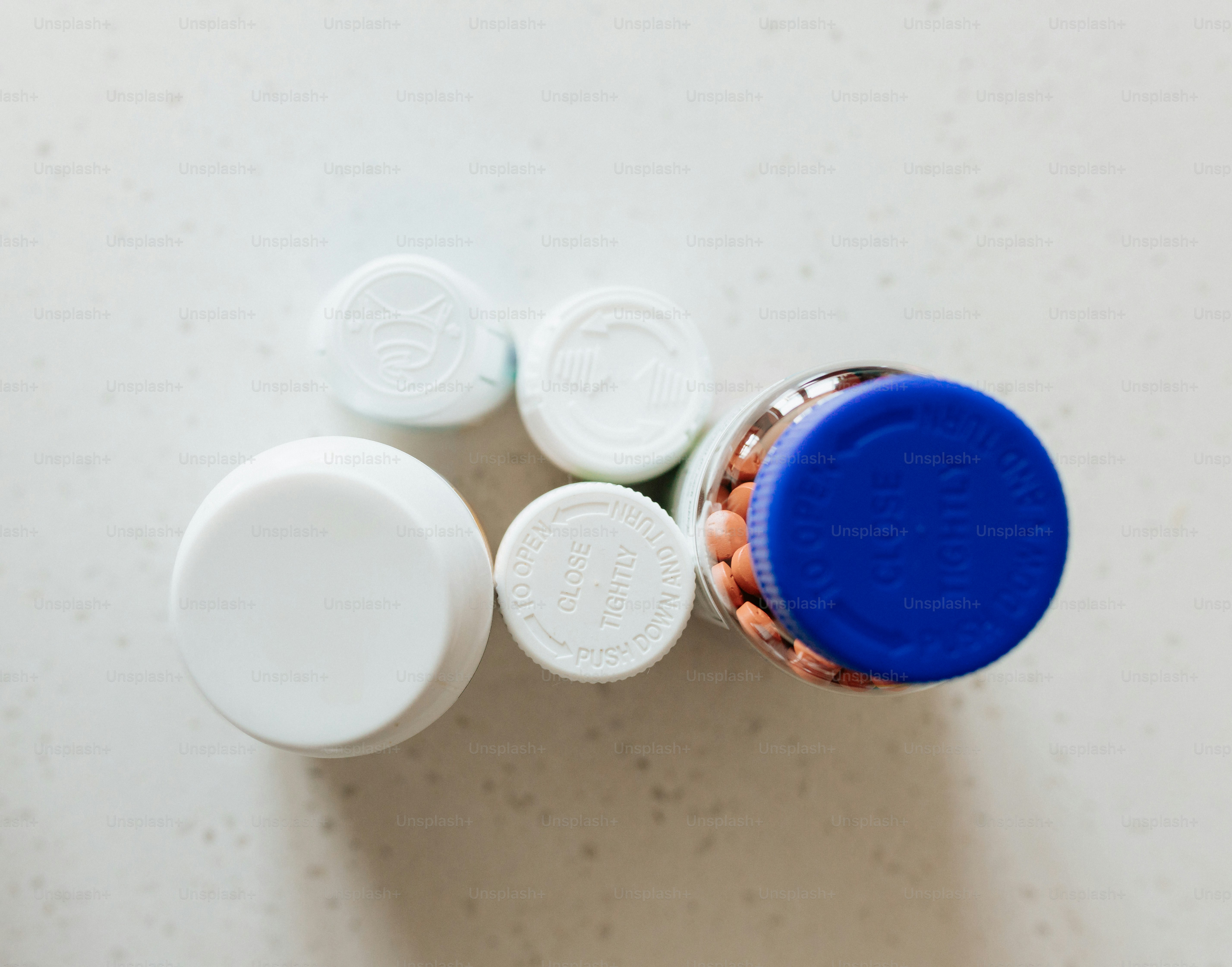 a close up of a jar of pills on a table