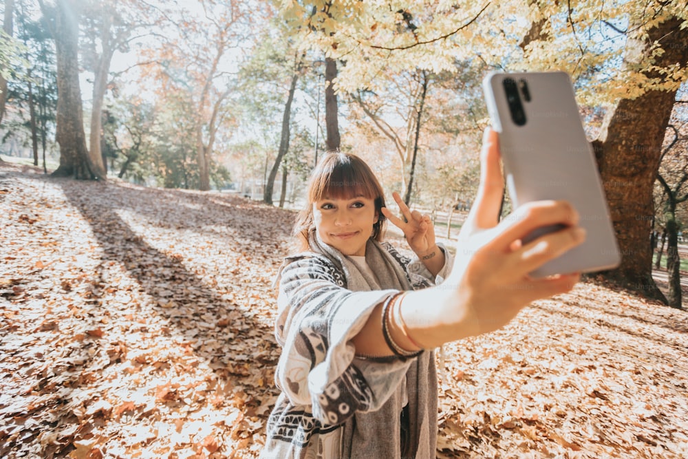 a woman taking a picture with her cell phone