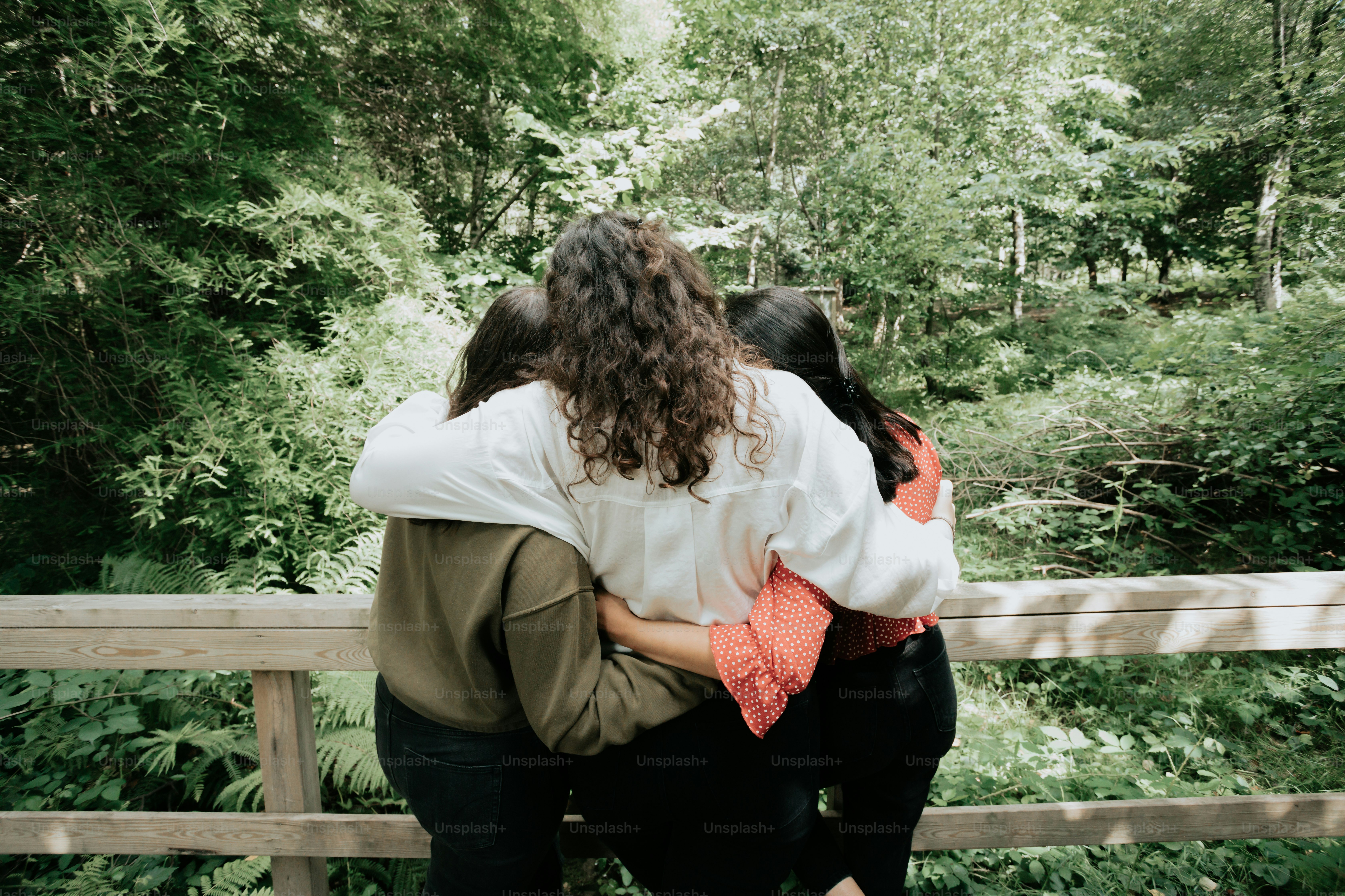 a couple of people that are hugging each other