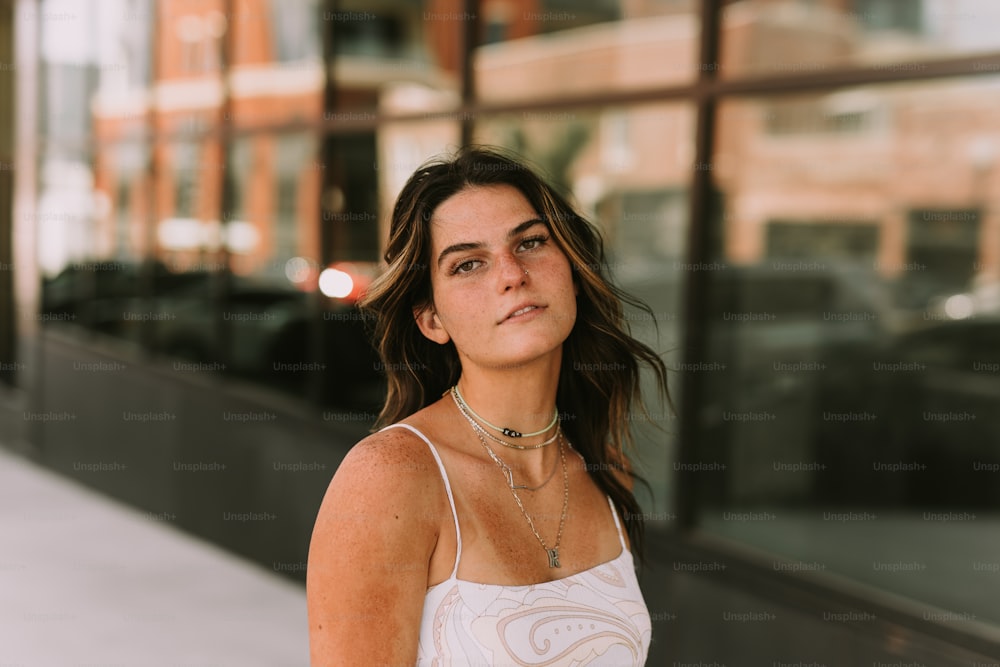 a woman standing in front of a building