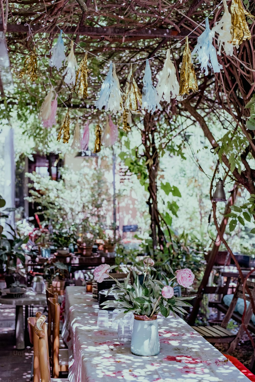 a table covered in a pink and white table cloth