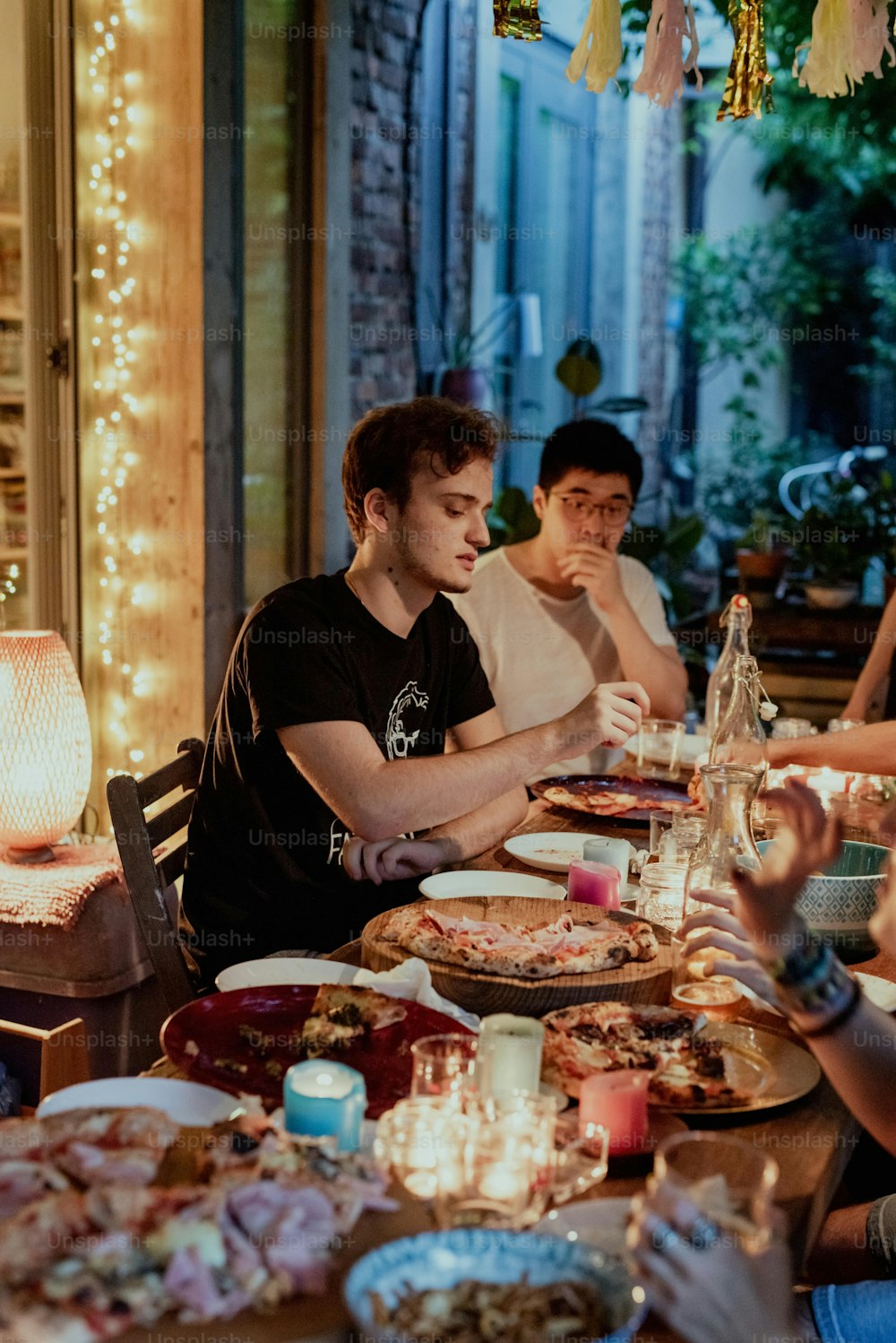 a group of people sitting around a dinner table