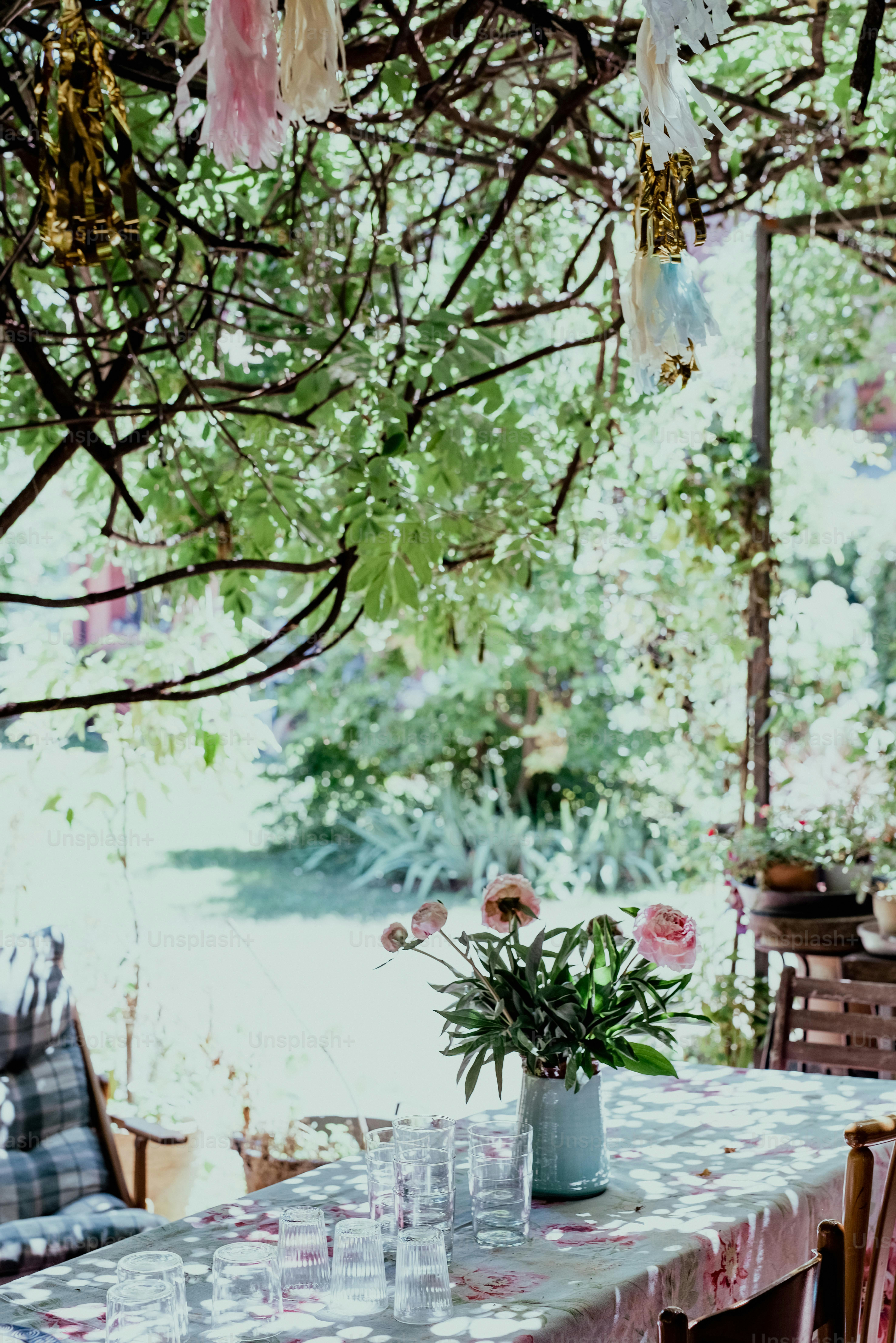a table with a vase of flowers on top of it