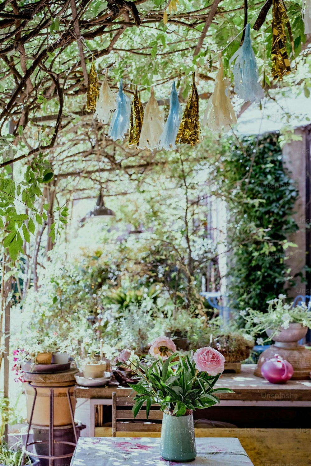 a table with a vase of flowers on top of it