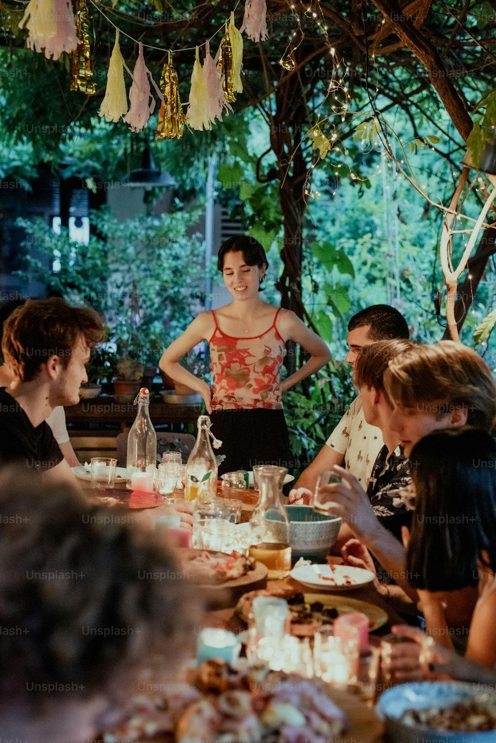 a group of people sitting around a dinner table