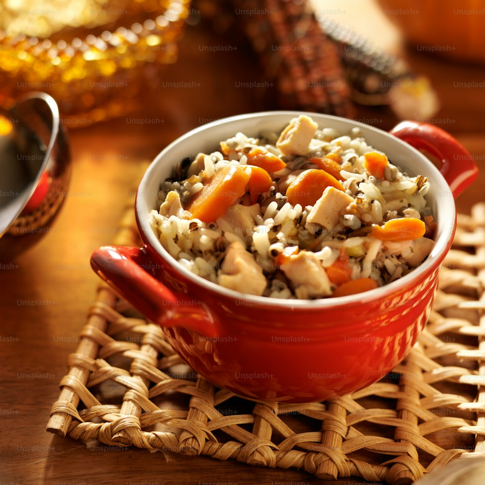 close up photo of chicken and wild rice with carrots