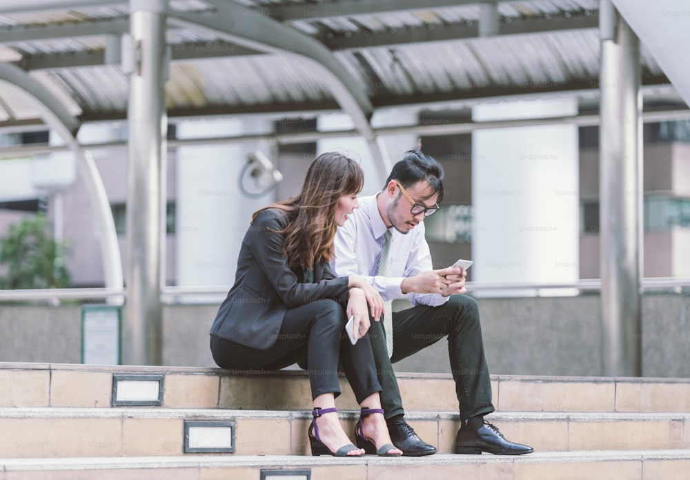 Business partners talking in an urban city setting