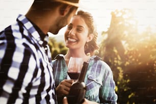 Romantic couple in vineyard before harvesting