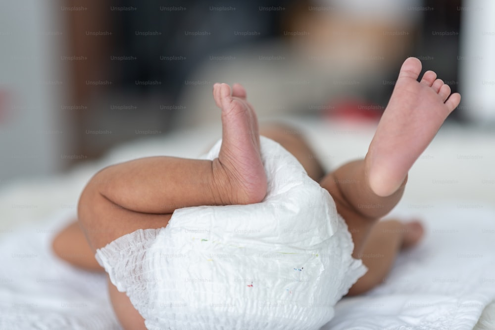 Newborn baby sleeping in bed