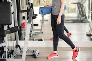 Pretty young sport woman is workout with mat  in gym, Healthy lifestyle