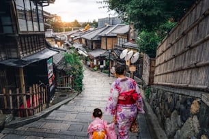 Kyoto, Japan Culture Travel - Asian traveler wearing traditional Japanese kimono walking in Higashiyama district in the old town of Kyoto, Japan.