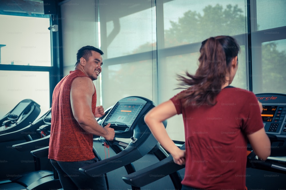 Couple exercising in the gym