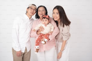 Happy Asian family on white background