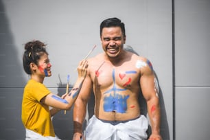 Couples are happy with painting on the body.