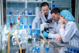 Science and medicine, scientist analyzing and dropping a sample into a glassware, experiments containing chemical liquid in laboratory on glassware, DNA structure, innovative and technology.