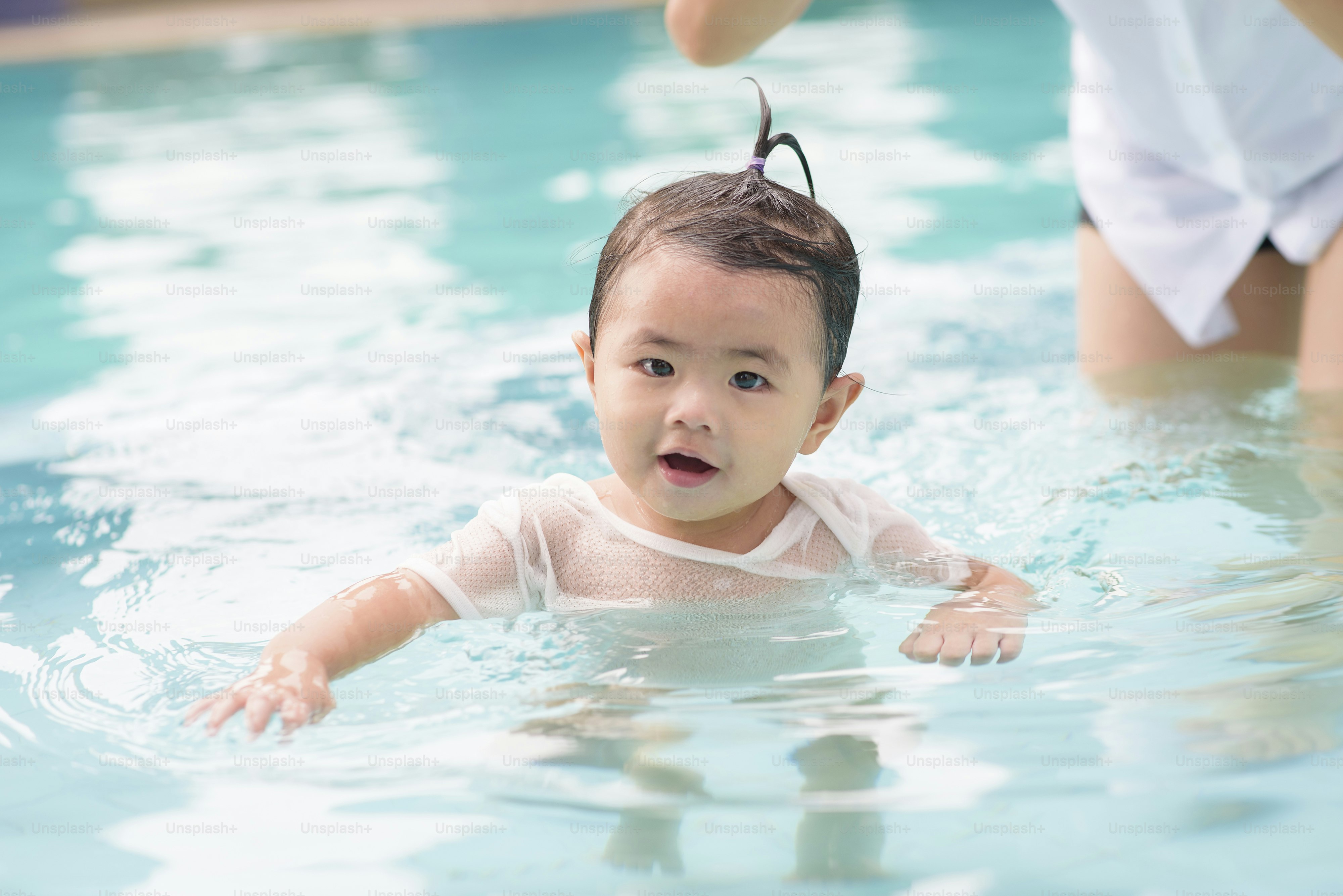 Baby swimming lesson in private home pool