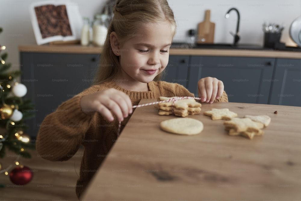 Cute girl packing cookies for Santa Claus