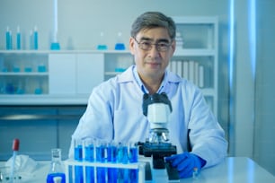 A portrait of scientist during experiment in laboratory, Science and technology healthcare concept