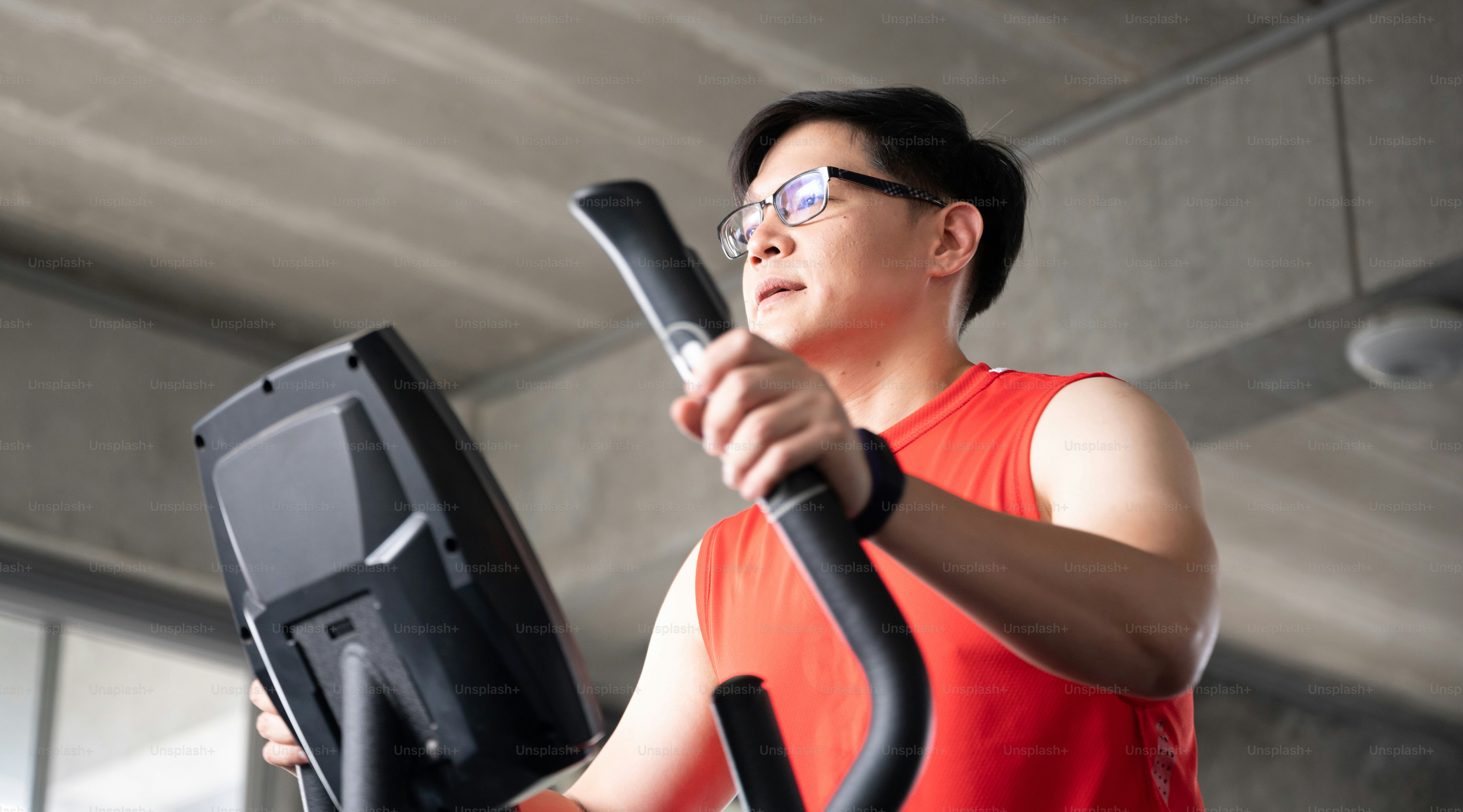 Group of Athletic Sports Running on a Treadmills at fitness club for wellness health. People at gym to build muscle and body strength. Exercise training concept.