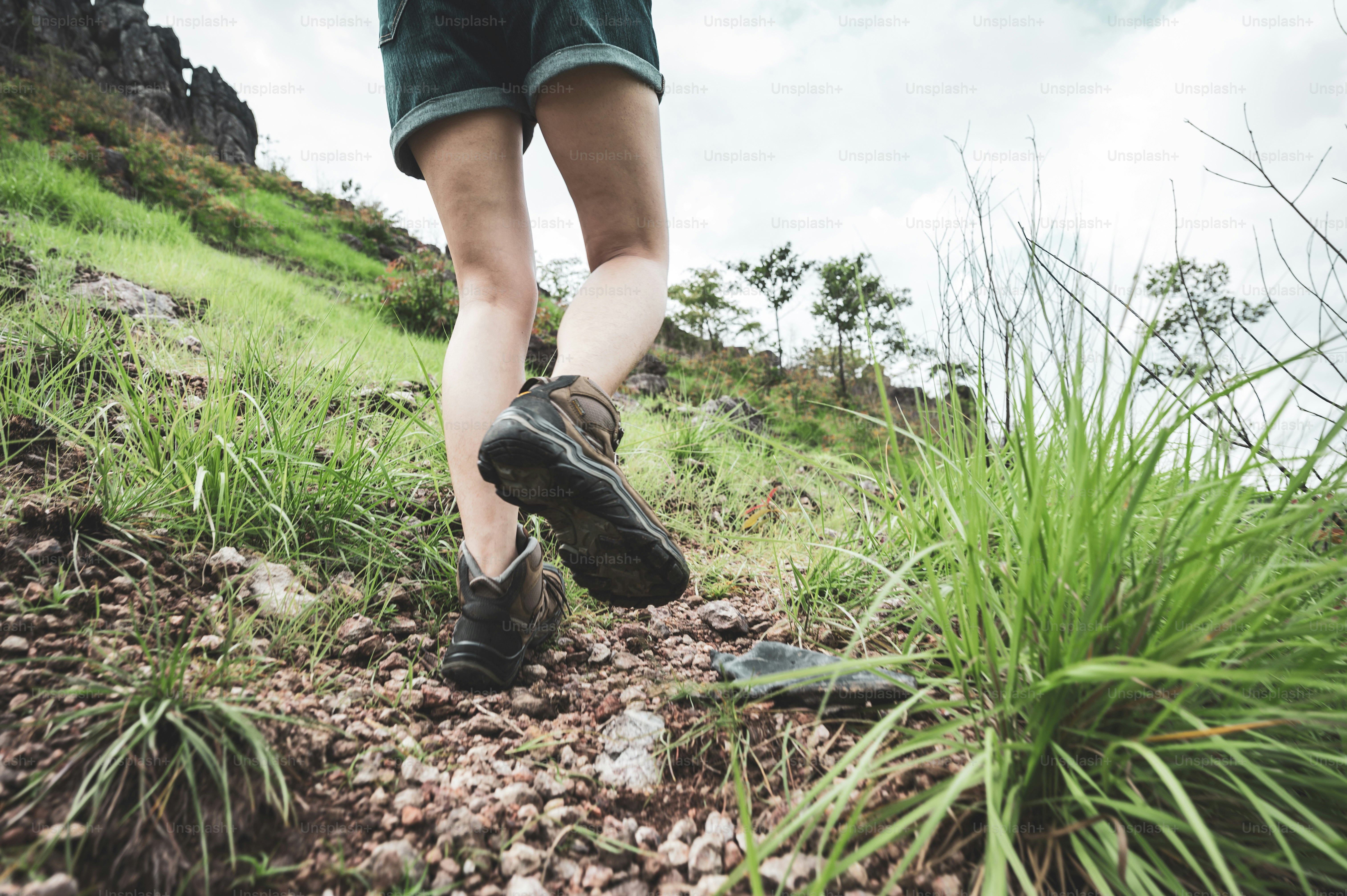 Hikers woman person with backpacks walking and travel to the mountain nature outdoor, adventure hiking sport lifestyle for trekking tourist activity, summer vacation journey to freedom relaxation