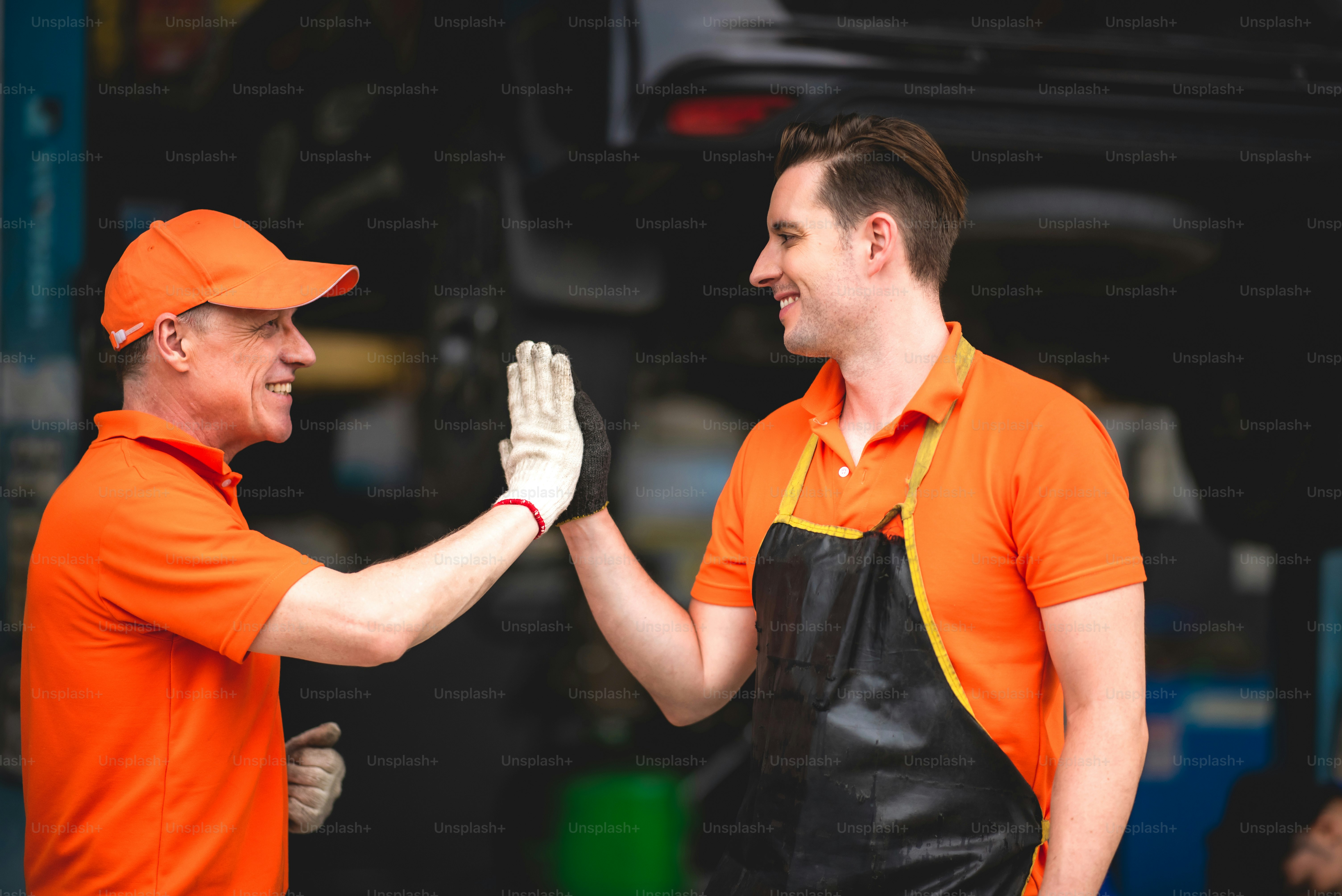 machanic team smiling to each other as they are a great teamwork, good teamwork good life, professional machanic engineer, work concept.wearing uniform