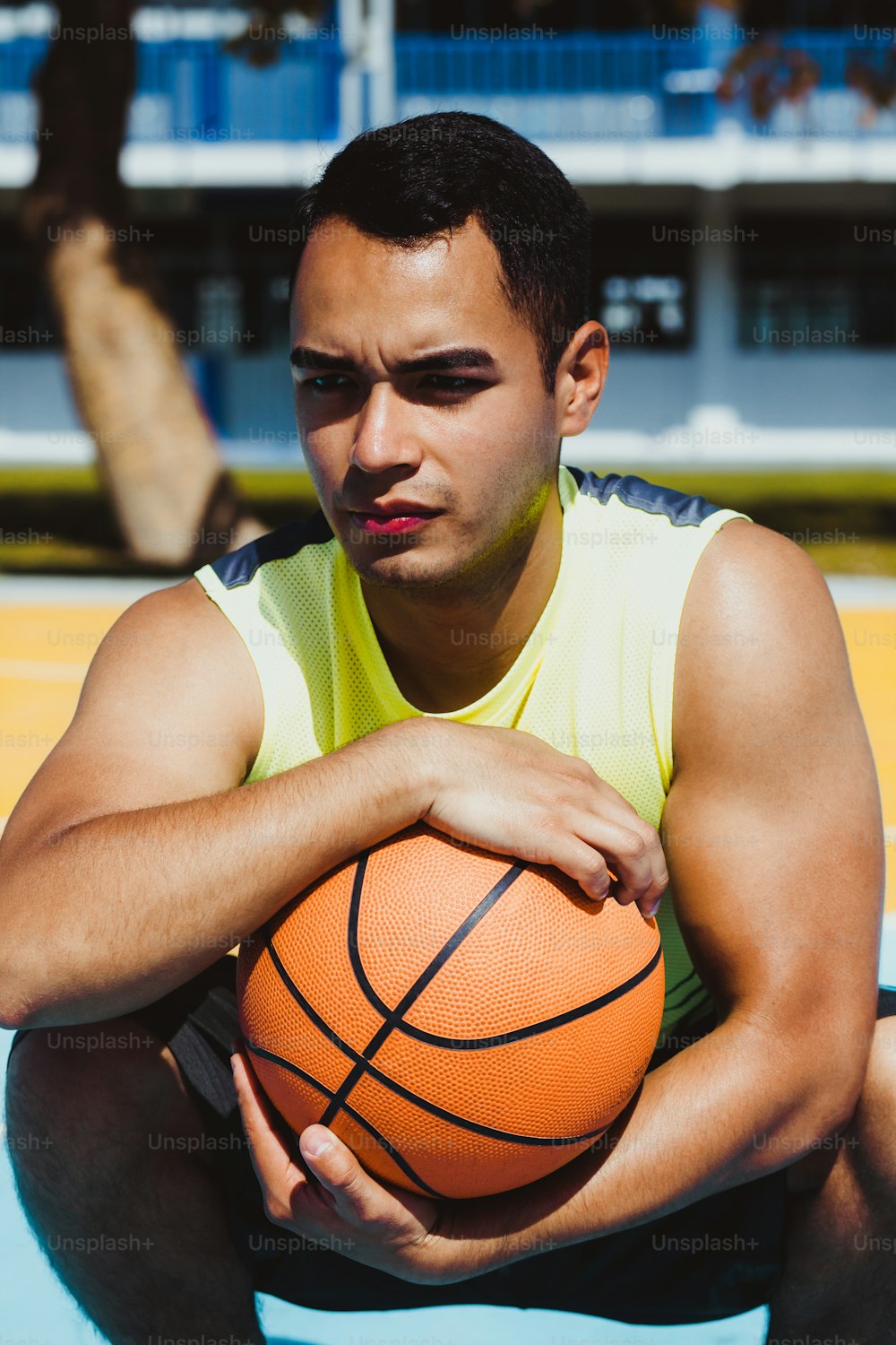 young latin man playing basketball portrait in Mexico